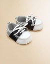 An adorable pair of colorblock, faux-tie mocassins will keep little feet stylish and cozy.Slip-on with faux-tiePolyurethane upperCotton lining75% polyurethane/25% rubber soleImported