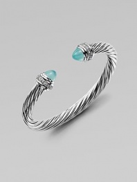 From the Cable Collection. An iconic design with aqua chalcedony caps accented in dazzling diamonds. Aqua chalcedonyDiamonds, .48 tcwSterling silverDiameter, about 2½Slip-on styleImported 
