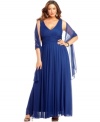 Classic details make this plus size Alex Evenings gown shine. A stunning V-neck at the front and back, along with a pleated empire waist, give this dress its fantastic fit.