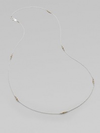 A graceful sterling silver chain, delicately spaced with clusters of tiny, faceted 14k gold beads.14k yellow gold and sterling silverLength, about 26Spring ring claspMade in USA