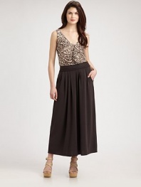 Offering a relaxed fit and just the right amount of stretch, this long skirt features a braided waist detail for bohemian appeal. Braided detail along waistbandSubtle pleatsSide zipperSlash pocketsAbout 38 long63% rayon/30% cotton/7% spandexDry cleanImported Model shown is 5'10 (177cm) wearing US size Small. 