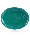 Homegrown style. An organic shape and engraved florals give the Espana Antica platter a handcrafted feel that suits country settings. With a glossy teal finish. From the Tabletops Unlimited dinnerware collection.