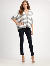 Classic stripes meet a modern silhouette including three-quarter dolman sleeves and a relaxed, poncho-inspired fit.V-neckDolman sleevesButton frontFront pocketsAbout 26 from shoulder to hem52% cotton/45% polyester/3% angoraHand washImported Model shown is 5'10 (177cm) wearing US size Small. 