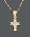 A sparkling token of your faith. Delicately small cross pendant features round-cut diamond (1/8 ct. t.w.) set in 14k gold. Approximate length: 18 inches. Approximate drop: 1/2 inch.