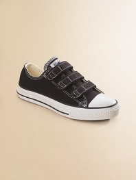 Signature Chuck style in a low-top version has three easy grip tape closures that make it simple to put them on and take them off. Rubber sole Traditional Chuck insole Cotton canvas Imported Please note: Toddler and infant sizes have two strapsFIT RECOMMENDATION: Because of generous cut, these sneakers run large. Please order 1 to 2 sizes smaller than regular shoe size.