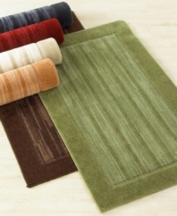 Offering timeless sophistication, this framed-stripe rug is available in six rich hues to complement any home décor. This handsome rug also features a stic-tite latex backing to stay in place at all times.