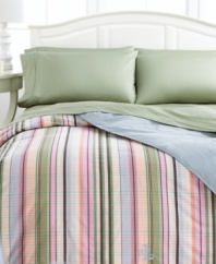 Show off your softer side with the incredibly cozy Martha's Vineyard down-alternative comforter from Lauren Ralph Lauren. This plush comforter boasts a pattern of preppy stripes on one side and soothing blue solid on the other, accented with an embroidered Lauren Ralph Lauren monogram at the base. Finished with stitched edges.
