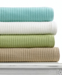 Add an extra layer of warmth to your bed or curl up on the couch with this cotton blanket from Martha Stewart Collection. Choose from either neutral or colorful hues.