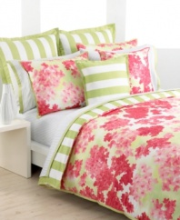 Add a bright bouquet to your Tommy Hilfiger bedding collection with this Cape Cod decorative pillow. A watercolor rendition of hydrangeas in shades of coral are complemented with bright coral merrow stitching along its edges. The reverse features a printed awning stripe, calling to mind the beautiful, carefree textiles of port towns.