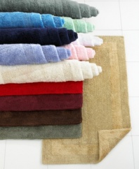 Pick a color, any color! This gorgeous rug will coordinate beautifully with any bathroom. In a heavy weight pile for superb absorbency and a plush feel. Finished with a tonal textured border. (Clearance)