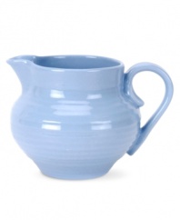 Like a blooming bed of forget-me-nots, this powder-blue porcelain dinnerware has a fresh, natural vibrance. A hand thrown texture gives the rounded creamer the irresistible charm of traditional pottery.