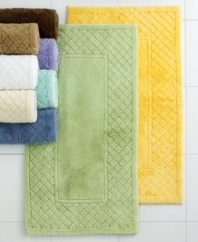 Soft to the touch, this Martha Stewart Collection contour bath rug refreshes your bath with casual comfort and a decorative pin dot design. Features tufted cotton with a non-skid latex back.