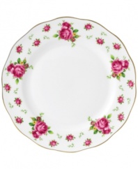 Revive a classic dinnerware pattern with the Vintage dinner plate. Lush pink blossoms plucked from the Old Country Roses collection flower on white bone china with a ruffled gold edge.