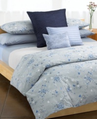Fresh pick. A pattern of watercolor florals add a refreshing touch to a textured background in this naturally-inspired Calvin Klein duvet cover. Featuring vat dyed and printed combed cotton percale. 220 thread count. Reverses to self. (Clearance)