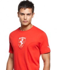 This startling red shirt pairs well with the Ferrari logo, as well as the Puma logo on the left sleeve. With a short crew neck and 100% cotton material, you'll feel the wind on your chest even if you aren't driving.