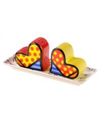 Must love patterns. Set in a tray, Heart salt and pepper shakers brighten any table with the vivid colors and bold patterns of world-renowned pop artist Romero Britto.