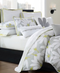 Everything's coming up daisies... this mod, fun comforter set creates a bright outlook with a bold floral pattern in soft 300 thread cotton sateen. Reverses to a solid 200 thread cotton for a great second look. Comfortably oversized and plumped with 12-oz. polyester fill. Shams feature citrus piping to highlight the pattern beautifully. A solid grey bedskirt grounds the look with sophistication.