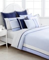 Tommy Hilfiger's European sham features white polka dots on a navy background, contrasting perfectly with the coordinating sheets sets. Finished with a navy and white striped border. Hidden zipper closure.