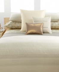 A warm straw hue borders the bed and draws out the rich textures and detailing of the duvet cover and decorative accents. The incredibly soft, woven bedskirt creates balance and gives the room a finished feel.