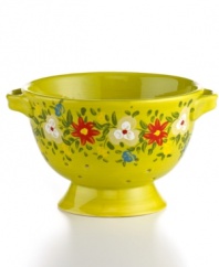 Very crafty. The lime-green Pasha colander appeals with a homespun look and feel in organically shaped, artfully hand-painted earthenware from Tabletops Unlimited. With a hidden design on its base.
