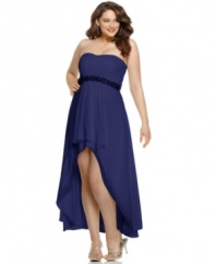 Get an old Hollywood-inspired look with this stunning plus size gown by Xscape. A pretty, lace-like detail at the waist accentuates the sleek silhouette that descends to a tiered, slightly ruffled high-low hem.