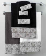 Out of this world. The Galaxy bath towel from Avanti brings cosmic chic to your bath with an exquisitely embroidered hem of planetary shapes in shimmering metallic silver. Choose from white, black or granite cotton.