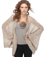 In an oversized shape, layer this open-stitch Free People sweater for a relaxed boho look!