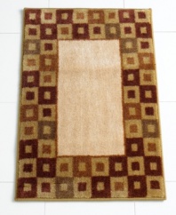 In plush cotton velour with a rich geometric motif, this decadently soft bath mat makes the canvas for very comfy feet.