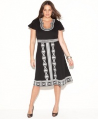 Elegant embroidery highlights INC's short sleeve plus size dress, featuring a flattering empire waist and A-line shape.