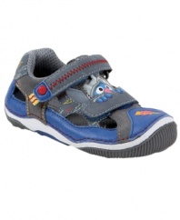 Start walking. He'll love strapping on these Stride Rite shoes featuring rounded edges for safety and his favorite furry blue friend for fun.