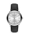 A sleek round dial is perfectly paired with a black leather strap in this modern, minimalist timepiece from Burberry.