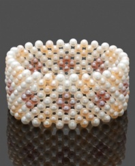 Polish your look with a chic cuff. This elegant design features a multitude of multicolored cultured freshwater pearls (4-5 mm) in a chic stretch design. Approximate length: 8 inches.