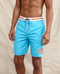 A student of summer style. These prepster swim shorts from Tommy Hilfiger will have you beach-ready.