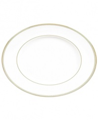 Serve with the impeccable style of Vera Wang. This serving platter shines with a textured band of golden grosgrain along the edge. Perfect for side dishes or smaller main courses.