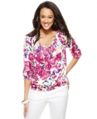 Fresh florals and sparkling sequins adorn this easy peasant top, from Charter Club.
