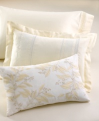 Delicate eyelet detail and lovely white embroidery add feminine charm to this soft cotton voile pillow in a buttery ivory hue.