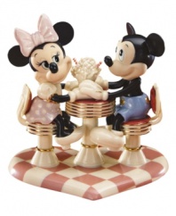 Mickey Mouse and Minnie Mouse savor one sweet treat in this charming Disney ode to the classic soda fountain. Accented with 24-karat gold and measures 7.75. Qualifies for Rebate