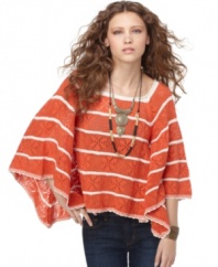 In the season's hottest shape, this cape-style Free People striped crochet top adds loose, laid-back volume to spring's skinny jeans!