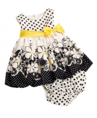 Daisies and dots are delightful on this darling dress from Bonnie Baby. Ribbon detail at the waist and matching polka dot bloomers add the finishing touch.