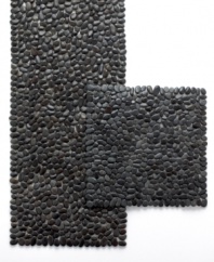 Rock out. The Beachstone table runner from Design Ideas has a serene sensibility yet striking impact on modern interiors. Glossy black stones affixed to transparent backing offer chic, textural contrast to minimalist place settings. (Clearance)