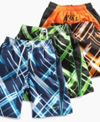 It's electric! He'll be charged up to put on these bright, laser plaid swim trunks from Nike.