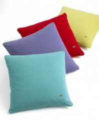 Add a preppy punch of color to any room with the Pique decorative pillow from Lacoste. Each pillow features the soft, 100% cotton pique fabric true to the essence of the famous Lacoste polo shirt, trimmed with pique piping along the edges. The pillow also features the signature embroidered crocodile logo and pearl Lacoste buttons on the reverse.