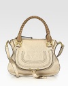 EXCLUSIVELY AT SAKS in Metallic Beige. Shimmering metallic calfskin leather covers this versatile shape, accented with elegantly-wrapped top handles in a contrasting tone. Double tennis-wrapped top handles, 6 dropShoulder strap, 18 dropTop zip closureHidden pocket under flapOne inside zip pocketOne inside open pocketCotton lining14½W X 10¾H X 4½DMade in Italy