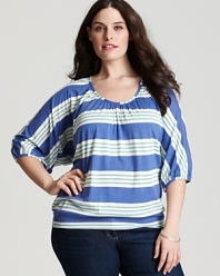 Playful cabana stripes pattern this Splendid top, designed in a relaxed silhouette eased by flowing dolman sleeves.