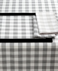 Tailor-made for classic settings, the Glen Plaid tablecloth offers menswear flair in an easy-care cotton blend. A lightly textured feel and shades of gray add to its sophisticated appeal. From Lauren Ralph Lauren. (Clearance)