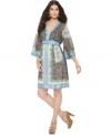 A beautiful print lends an elegant and unique touch to this kimono-inspired dress from ECI.