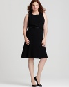 This Calvin Klein essential black dress flaunts a flirtatious flared skirt and belted waist for a ladylike silhouette.