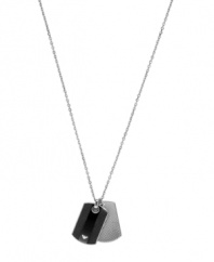 Make a bold statement in Emporio Armani's structured style. Two dog tag pendants in contrasting colors feature the company's signature logo set in onyx. Crafted in stainless steel and black silicone. Approximate length: 19 inches + 2-inch extender. Approximate drop: 25 mm x 10 mm.