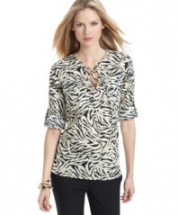 Add safari style to your spring wardrobe with this MICHAEL Michael Kors animal-printed blouse!