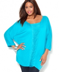 Turn up your frill factor with INC's three-quarter sleeve plus size tunic top, accented by a fringed inset.